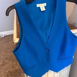 Blue women’s vest, cupcakes and cashmere